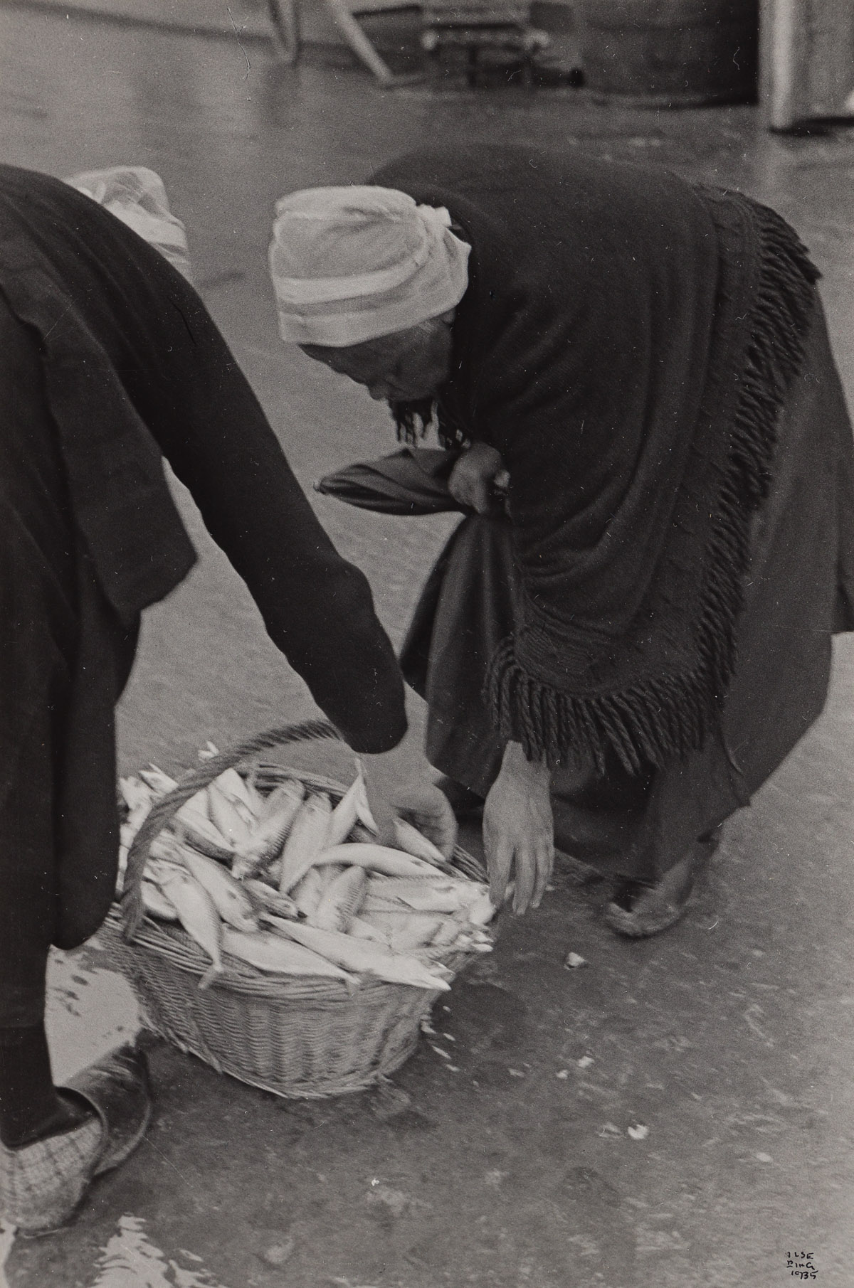 ILSE BING (1899-1998) Bretagne, women with fishing in basket.